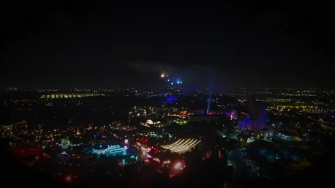 Drone Flight in Theme Park at Night with Fireworks Neon Lights Stock Footage 166713079