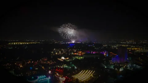 Drone Flight in Theme Park at Night with Fireworks Neon Lights Stock Footage 166713205