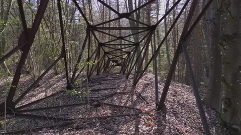 Drone Flight Through Abandoned Metal Tower Structure in Spring Forest Stock Footage 332308464