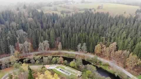 Drone flight through the clouds over the autumn forest and the river Stock Footage 144452039