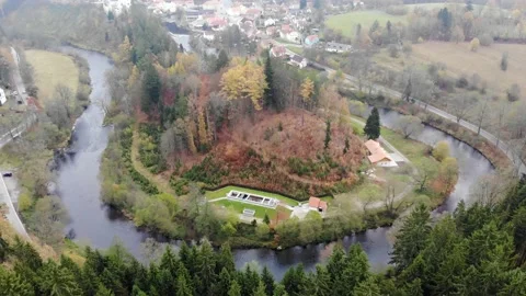 Drone flight through the clouds over the autumn forest and the river Stock Footage 145050596