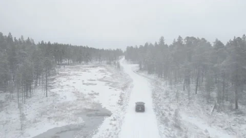 Drone Flight Through Forest With Car Driving On Winter Road Stock Footage 221485415