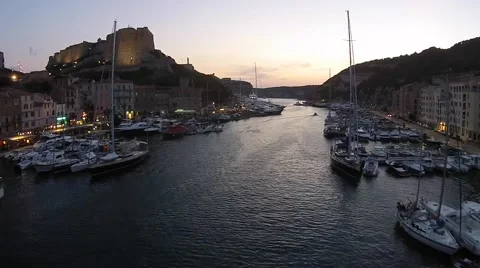 Drone flight through harbour of Bonefacio around sunset Video stock 58636583