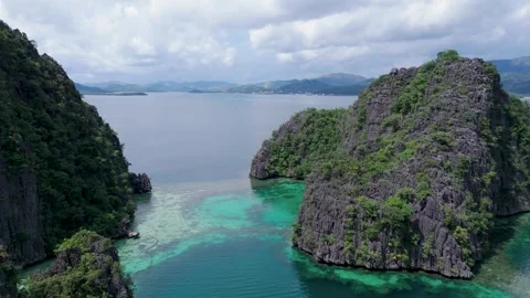 Drone Flight Through Limestone Cliffs and Lagoon – Coron Palawan Stock Footage 320855029
