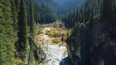 Drone Flight Through Narrow Mountain Gorge. Kazakhstan, Lake Kaindy Stock-Footage 332943759