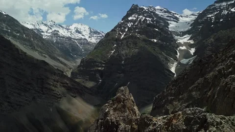 Drone flight through snowy mountain peaks, rocky. Stock Footage 274721976
