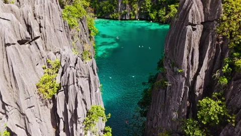 Drone Flight Through Twin Lagoon Coron Palawan - Tropical Paradise Lagoon Видео 332369904