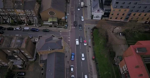 Drone flight, top down, following traffic on city street in London England. Video stock 85442997