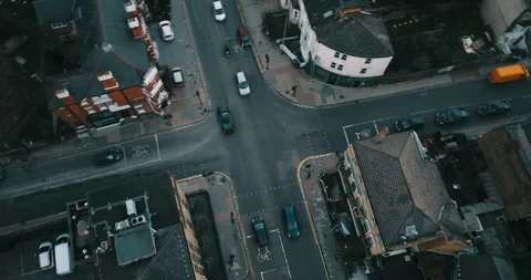 Drone flight, top down, following traffic on city street in London England. Видео 85443720
