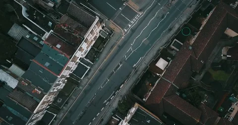 Drone flight, top down, following traffic on city street in London England. Видео 85443966