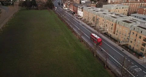 Drone flight, top down, following traffic on city street in London England. Видео 86007508