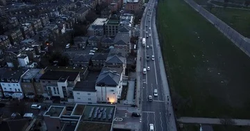 Drone flight, top down, following traffic on city street in London England. Stock Footage 86011426