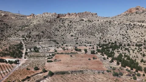 Drone Flight Toward Desert Cliff Caves Near Deyrulzafaran Monastery 4K Video stock 337063582