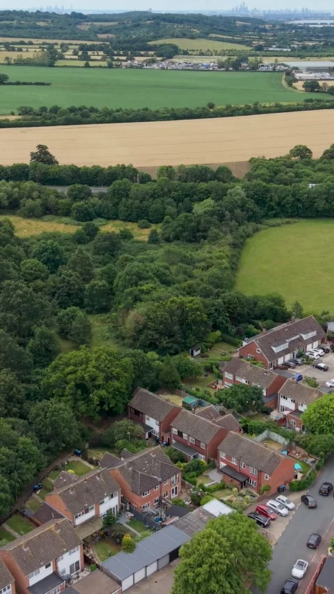 Drone flight toward M25 motorway near Waltham Abbey, UK, passing suburbs to 動画素材 339769340