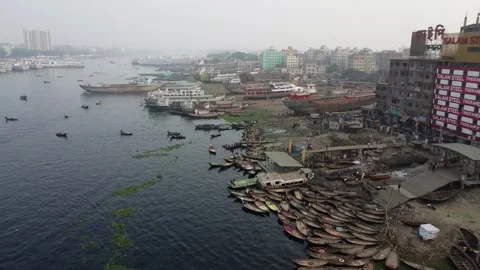 Drone Flight Toward Small Boat Dock with Shipyard and Smoggy City in Background Video stock 327351555