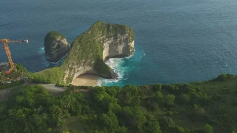 Drone Flight Toward T-Rex Cliffs at Kelingking Beach Past Construction Site Stock Footage 315081960