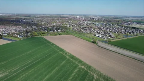 Drone Flight Towards Small Dutch Town Over Empty Farmland Stock Footage 275156475