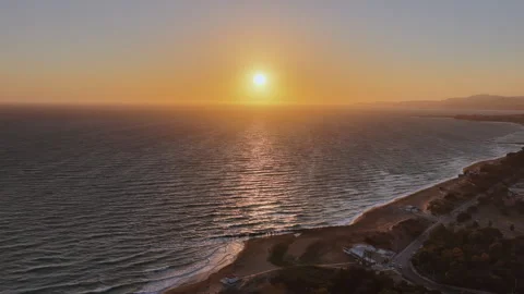 Drone Flight Towards Sunset over Mediterranean Sea with Beach, Sicily, Italy Stock Footage 317447382