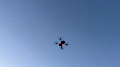 A drone flight in the twilight at sunset with red signal light Stock Footage 280203870