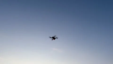 A drone flight in the twilight at sunset with red signal light Stock Footage 280203963