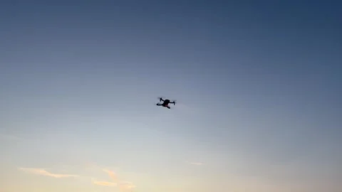 A drone flight in the twilight at sunset with red signal light Stock Footage 280320890