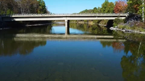 Drone Flight Under Concrete Bridge: Matane River Autumn. Video stock 304296683