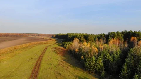 Drone flight under the tin river at the Ukrainian village at the autumn. Video stock 97755077