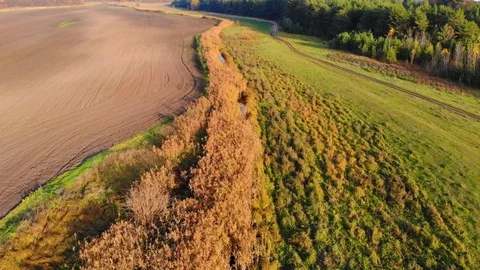 Drone flight under the tin river at the Ukrainian village at the autumn. Stock Footage 97755785