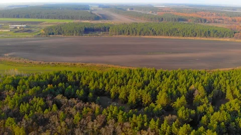 Drone flight under the tin river at the Ukrainian village at the autumn. Stock Footage 97756190