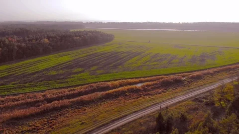 Drone flight under the tin river at the Ukrainian village at the autumn. Video stock 97756477