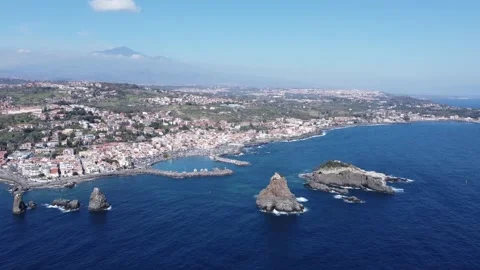 Drone flight view of Acitrezza bay with Etna volcano in background in Sicily Stock Footage 149777722