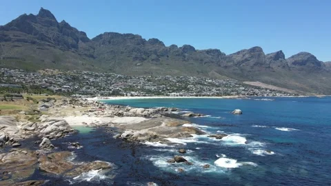 Drone flight with view of Camps Bay and Twelve Apostles mountain range Stock Footage 167773451