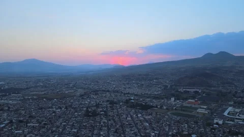Drone Flight view in a city. Top view. Cityscape in sunset soft light. Stock Footage 151000842