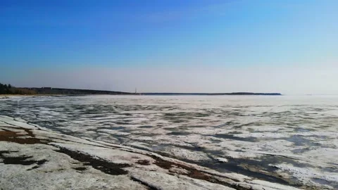 Drone flight with a view of the sandy beach and the sea in the melting ice. Stock Footage 133763108