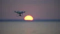The drone flighting on the bright sunrise background 4k or 4k+ Resolution