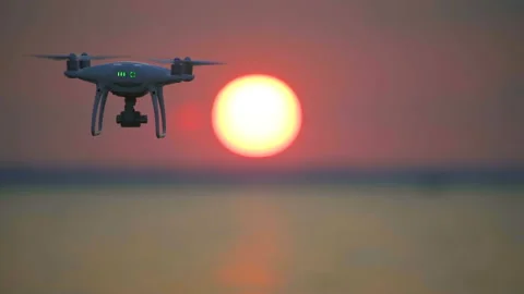 The drone flighting on the bright sunset background Stock-Footage 94450551