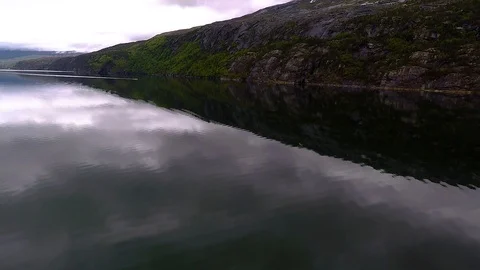 A drone fly above fthe fjord Stock Footage