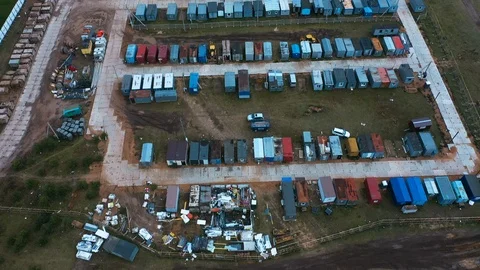 Drone fly above town of red and blue prefabricated lodges for construction Stock Footage 120007432