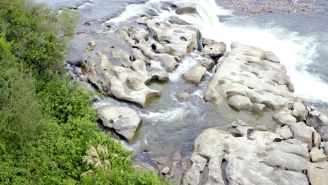 Drone fly across the top of a waterfall Stock Footage 155467495
