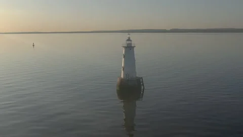 Drone fly in and out over lighthouse sunrise. 4k Stock Footage 151538710