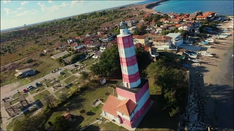 Drone fly around an old lighthouse on the coast of Shabla Stock Footage 320564621