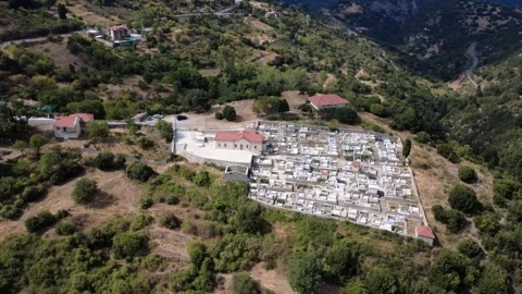 Drone Fly Around Outside Hill Cemetery with White Marble Graves in Greece Vídeo Stock 321861044