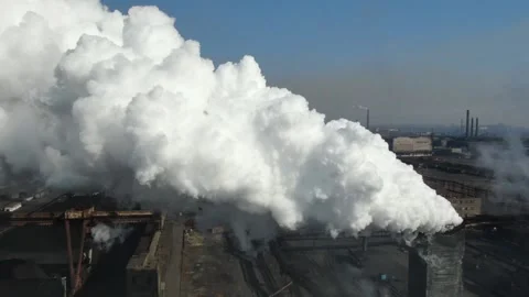 Drone fly around toxic enterprise chimneys tubing against the sky background Video stock 149352014