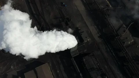 Drone fly around toxic enterprise chimneys tubing against the sky background Stock Footage 149352023