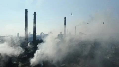 Drone fly around toxic enterprise chimneys tubing against the sky background Stock Footage 149352027