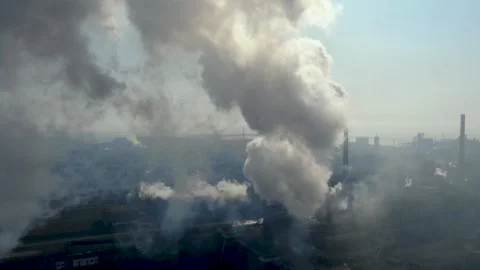 Drone fly around toxic enterprise chimneys tubing against the sky background Video stock 149352198
