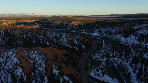 Drone Fly Backward Car Chase Bryce Canyon Utah Usa Sunset Snow Wild Forest Stock Footage 186943147