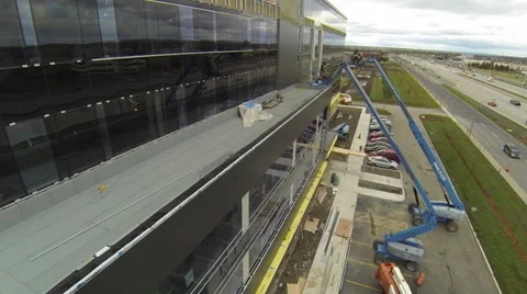 Drone fly backwards over construction cranes Stock Footage 63939048