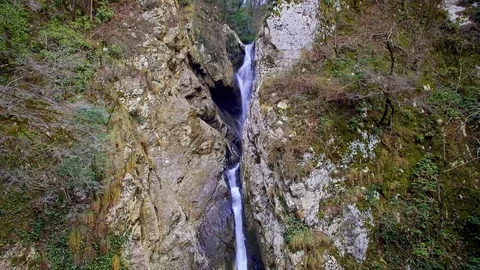 Drone fly to cascade waterfall among two high cliff 스톡 동영상 84775091