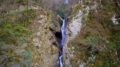 Drone fly to cascade waterfall among two high cliff in autumn day 스톡 동영상 84775143